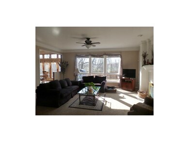 Living room with large windows looking out over de