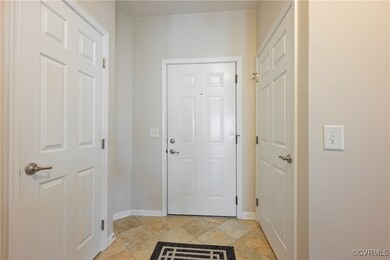 Doorway to outside featuring light tile patterned