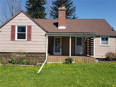 Back of home with covered porch