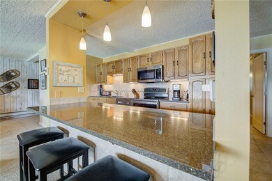 Updated kitchen with warm colors, refinished cabin