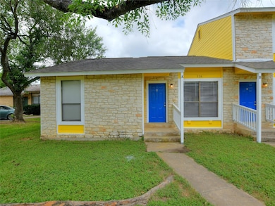 View of front of property featuring stone siding,