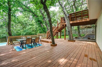 Massive 30x24 deck with steps down to a sparkling 