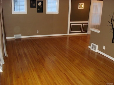 Spacious living room off front entrance foyer with