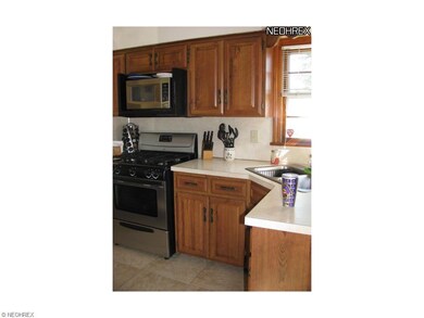 Kitchen with newer stainless griddle top stove, an