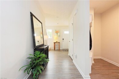 Cheery and light filled front entry greets you.