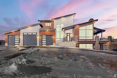 Modern home featuring a chimney and driveway
