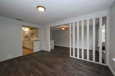 Unfurnished living room with wood finished floors