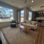Living area with recessed lighting and wood finish