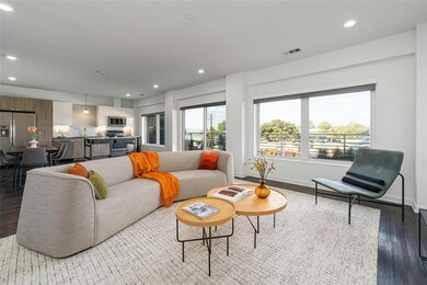 Living area featuring baseboards, recessed lighti