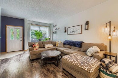 Additional view of the living room, highlighting the natural light and open layout
