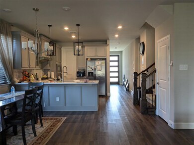 View of kitchen and breakfast area from the living room