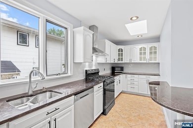 Large kitchen with skylight