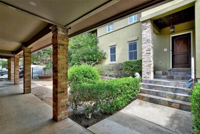 Doorway to property featuring stucco siding and f