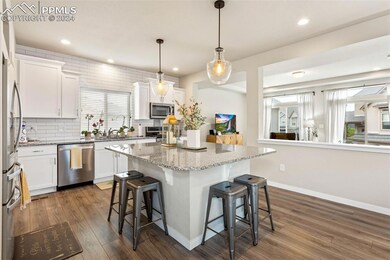 Kitchen featuring a center island, stainless steel