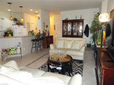 Great Room - Tile floors, Breakfast Bar & New Lighting Fixtures