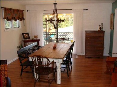 Dining area with view of deck and large backyard