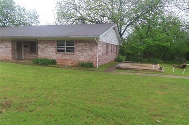 South side elevation has a large storm shelter.