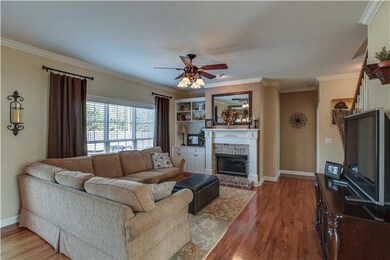 Living Room - Gas Fireplace w/ Built-Ins; Hardwood flooring.