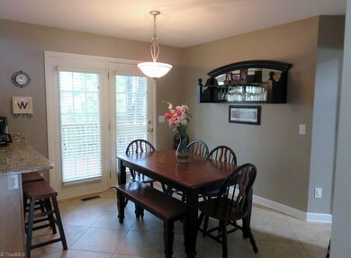 Spacious breakfast area leads to the deck.  All fixtures are updated.