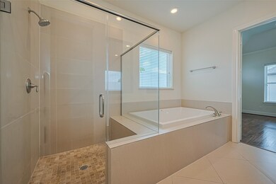 GARDEN TUB AND SEPARATE SHOWER IN MASTER BATH.