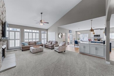 Soaring great room opens easily to the breakfast r
