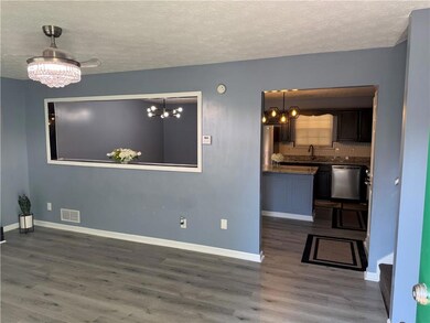 Gorgeous fireplace and open to kitchen area