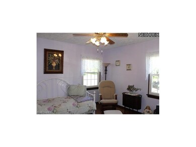 Bedroom #1 is in the front of the home and has bea
