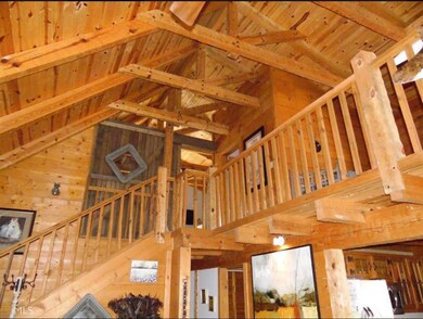view from downstairs looking up staircase to bedro