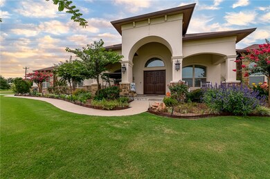 Doorway to property with a yard and stucco siding