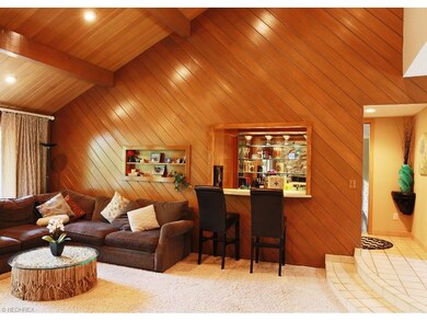 Family room with vaulted ceiling and wet bar
