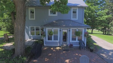 Spacious brick patio is well shaded! Step inside t