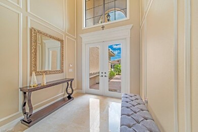 Foyer with upgraded glass impact doors and custom 