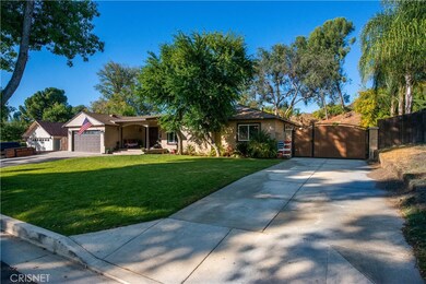 Huge front yard with 2 car garage and separate concrete driveway for RV acces.