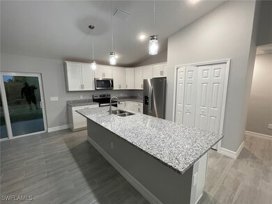 Kitchen featuring appliances with stainless steel