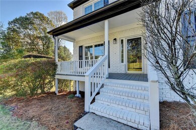 Property entrance featuring a standing seam roof, 