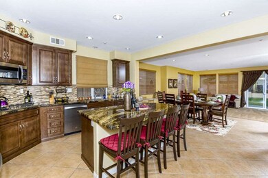 Great Room with renovated kitchen, dining area, an