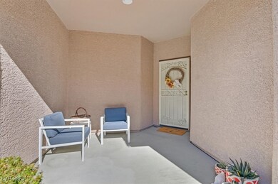 Doorway to property with stucco siding
