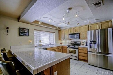 Spacious kitchen with breakfast bar and stainless 