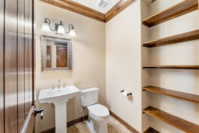 Powder Bathroom just off of the entry with pedesta