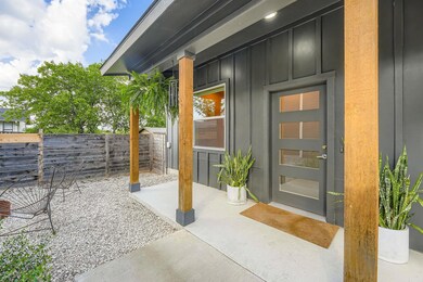 Doorway to property with board and batten siding 