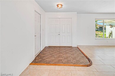 Entrance foyer featuring tile flooring
