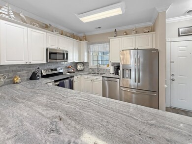Kitchen with visible vents, light stone countertop