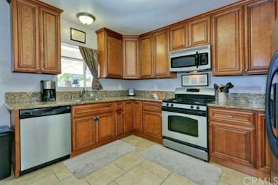 Kitchen with stainless steel appliances and granit