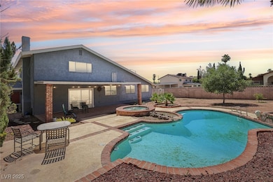 View of pool featuring an in-ground hot tub, a pat
