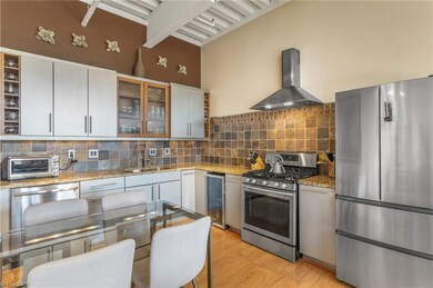 Kitchen with newer stainless appliances. Notice there's also a beverage fridge.