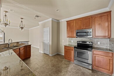 Sleek kitchen featuring elegant granite countertops.
