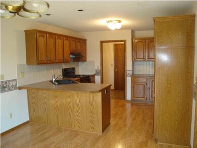 Upgraded kitchen with new flooring and countertops