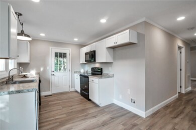 Kitchen w/ door onto the back porch