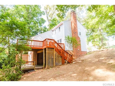EXTERIOR BACK W/ LARGE DECK & PATIO, WALK-OUT BASE