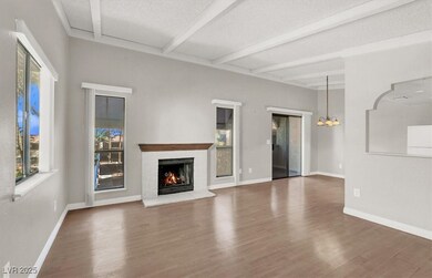 Unfurnished living room featuring a textured ceili